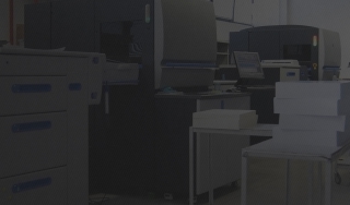 Stacks of paper on a cart; taken in a printing facility